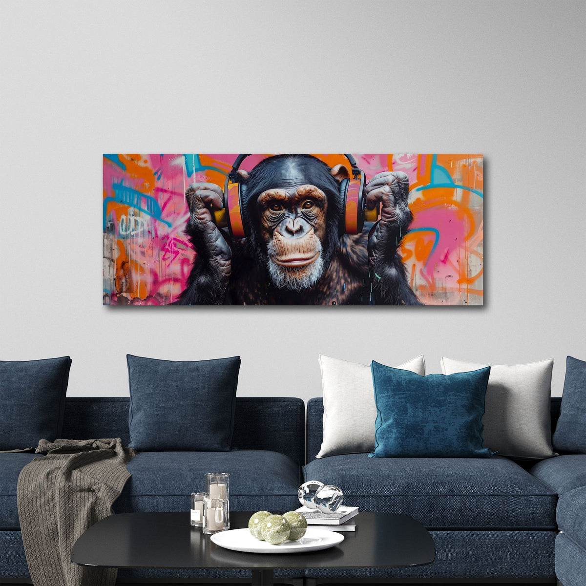 Schimpanse mit orangen Kopfhörern als Panorama Wandbild